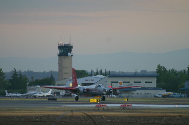 Lockheed P-2 Neptune (N443NA) - KRDD - after a long day - Tanker 43 arrived back at Redding and on taxi to the Phos-chek loading area - this plane was up in the air all day on fire drops in the Redding area off Hwy 299 10 miles east of Redding - Thank you Pilots!