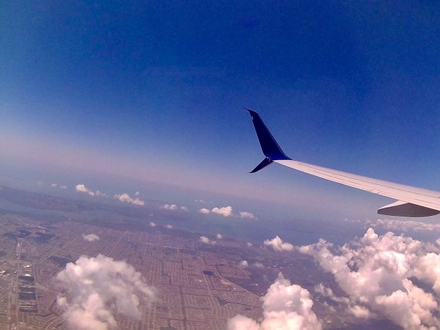 Boeing 737-900 (N869DN) - Just after takeoff from RSW.  The gulf waters are extra blue in the distance!