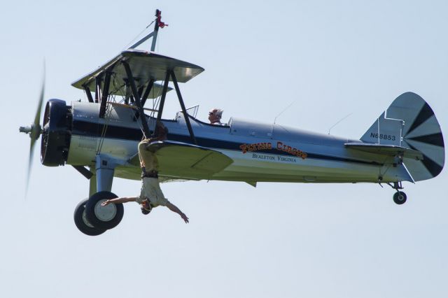 Boeing PT-17 Kaydet (N68853) - Chuck Tippett hanging off the wing of the Flying Circus PT-17 during their weekly air show.