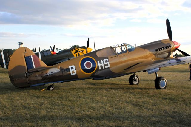 CURTISS Warhawk — - Curtis P-40 at Oshkosh at the Golden Hour.  The Brits called it a Kittyhawk or Tomahawk depending on the model. 