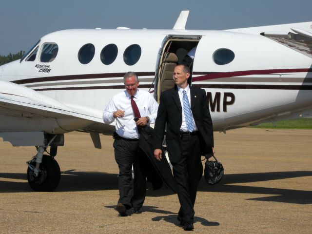 N2MP — - Missouri governor Jay Nixon(left) steps from the Missouri Highway patrol plane at the Poplar Bluff airport.