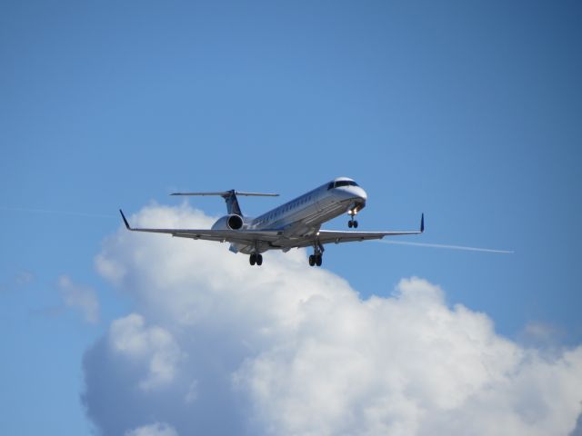 Embraer EMB-145XR (N11199) - ASQ4120 lands RWY24R at Cleveland Hopkins International Airport with crossing traffic behind. 