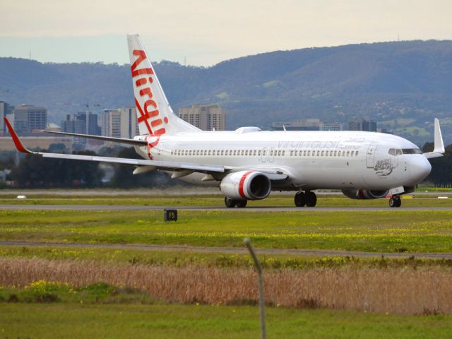 Boeing 737-700 (VH-VOK) - On taxi-way heading for take off on runway 05. Thursday 12th July 2012.