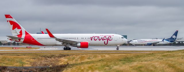 BOEING 767-300 (C-FMWQ) - ROUGE heads to the runway while Aeromexico lines up on 06R