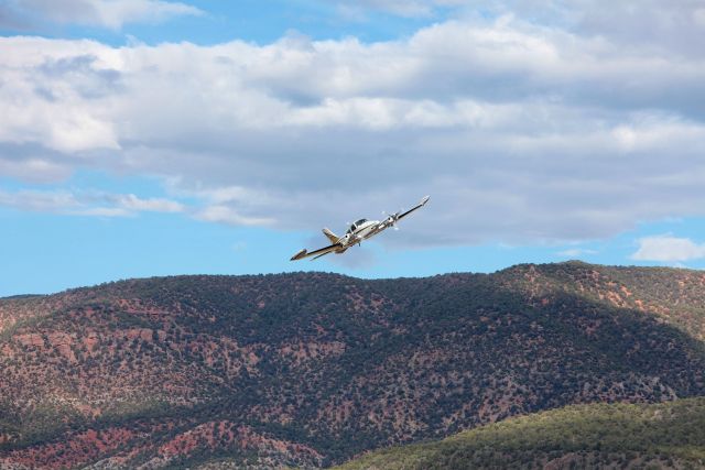 Cessna 310 (N310CE) - Photo taken from highway of a departure from Parowan Utah along the beautiful Wasatch range.