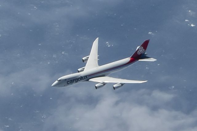 Boeing 747-200 — - Over the Atlantic, west to east. We were doing .82 and this CargoLux 747 slid by at maybe .84 6,000ft below us - Nikon 850 24/70 2.8 Lens, tight crop maybe 5% of frame