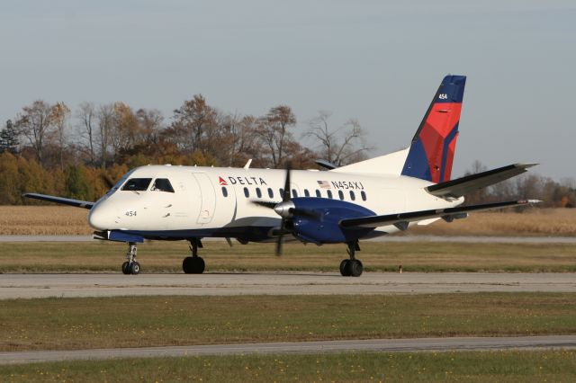 Saab 340 (N454XJ) - October 26, 2009 - leaving terminal at London Airport 