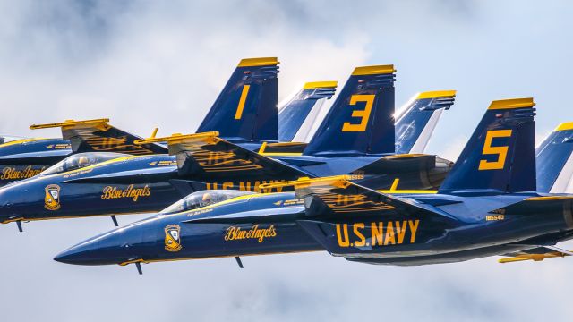 McDonnell Douglas FA-18 Hornet — - This photo was taken at the VERY FIRST show where the Blue Angels flew their new F18 SUPER HORNET. The show was at the Sun N Fun Aerospace expo in Lakeland Florida April 2021. I believe this photo captures the essence of what the Blue Angels are about. Precision flying and outstanding aircraft. I used 600mm of Canon lens and the camera settings were 1/8000 F5.6 ISO 800. Please check out my other photography. Positive votes and comments are always appreciated. Questions about this photo can be sent to Info@FlewShots.com