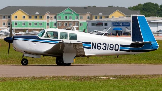 Mooney M-20 (N6319Q) - At Sun n Fun.  That's me PIC in the left seat taxiing to parking. 