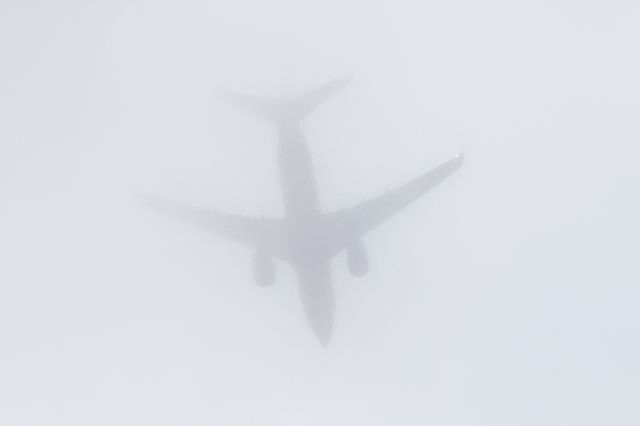 Boeing 737-700 (N7812G) - climbing through the clouds