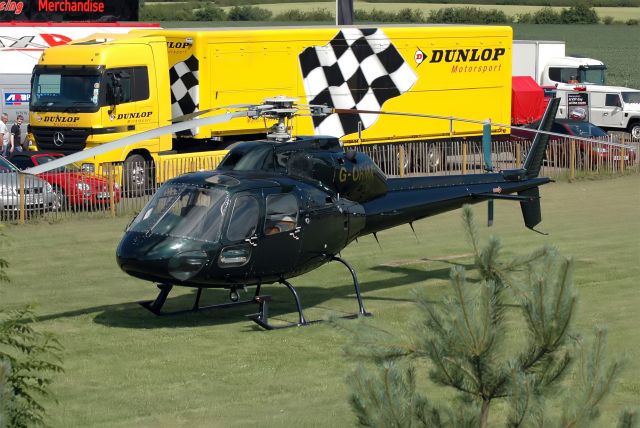 HELIBRAS VH-55 Esquilo (G-ORMA) - MW Helicopters Ltd Aerospatiale AS355F Ecureuil 2 (G-ORMA) located at a BTCC race meeting at "Croft Circuit" Teesside, near MME, UK (Photo July 2005)