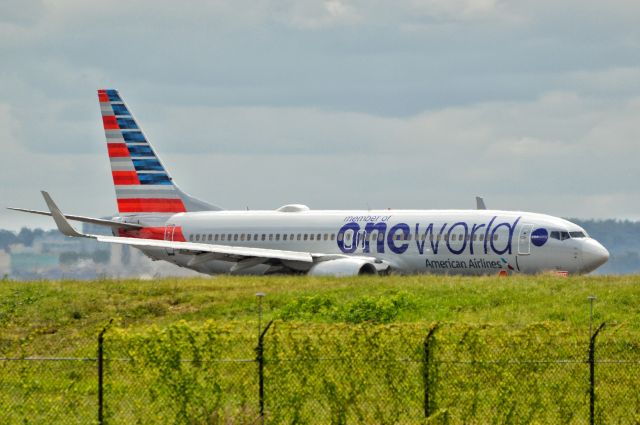 Boeing 737-700 (N837NN) - A Boeing 737-800 in one world livery operated by American arrives at Reagan Airport, in from dfw, 20190826.br /br /br /© 2019 Heath Flowersbr /br /Contact photographer for reproduction(s).