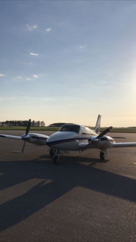 Piper PA-30 Twin Comanche (N17MB) - Sunrise behind PA-30 Twin Comanche N17MB on the ramp at Batavia, NY (KGVQ).