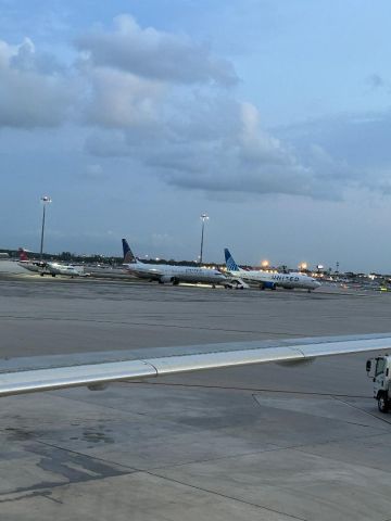 NXXXXX — - Seen behind the wing of N641JB, 2 United 737s and a Silver ATR resting before their departures