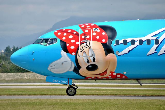 Boeing 737-900 (N318AS) - Close up of the nose section of this colourful Disneyland paint scheme.