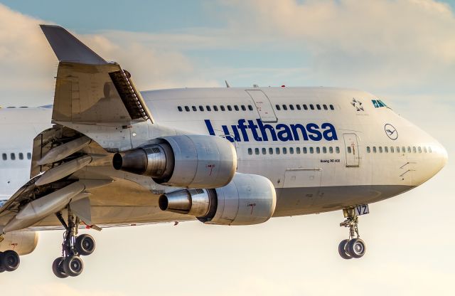 Boeing 747-400 (D-ABVZ) - February sunset shining directly down runway 23 on the nose of this Lufty 744