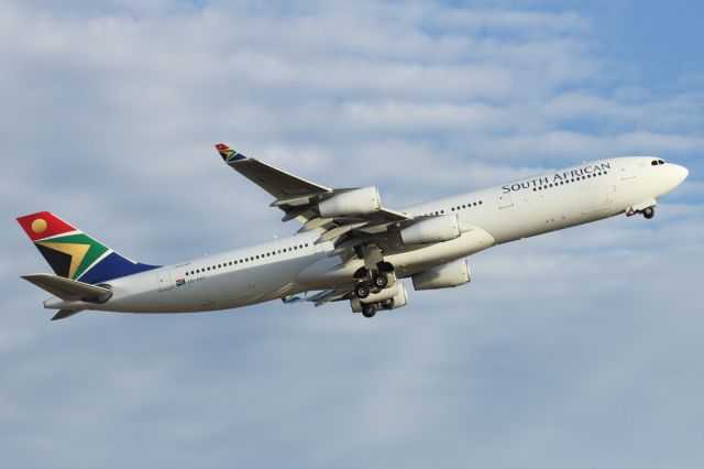 Airbus A340-300 (ZS-SXC) - Departing LHR.
