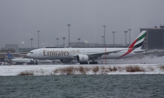 BOEING 777-300ER (A6-ECJ) - Morning departure from BOS to Dubai before a winter storm hit New England. 