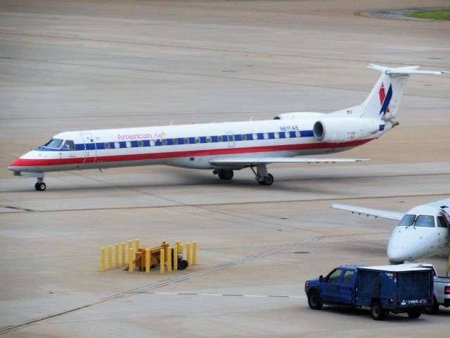 Embraer ERJ-145 (N615AE) - American Eagle/Trans States Airlines (AA/AX) N615AE ERJ-145 LR [cn145087]br /Dallas Fort Worth (DFW). American Eagle/ Trans States Airlines flight AA3397/AX3397 just arrived from Wichita Falls (SPS). This white livery was replaced by a new silver livery in 2013 following the American Airlines merger with US Airways.br /Taken from the terminal.br /2014 07 31  a rel=nofollow href=http://alphayankee.smugmug.com/Airlines-and-Airliners-Portfolio/Airlines/AmericasAirlines/American-Eagle-AAAXCPENEVMQOHOOYVYXZWhttps://alphayankee.smugmug.com/Airlines-and-Airliners-Portfolio/Airlines/AmericasAirlines/American-Eagle-AAAXCPENEVMQOHOOYVYXZW/a