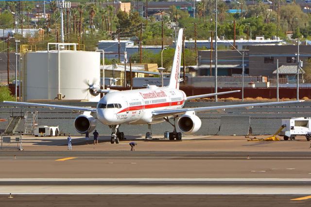 Boeing 757-200 (N757HW) - Honeywell Boeing 757-225 N757HW engine testbed at Phoenix Sky Harbor on July 22, 2018. It has a TPE331-14 turboprop engine installed on its test pylon. A spinner and sharks mouth and eyes inspired by the P-40s of the Flying Tigers have been addded to the nacelle.