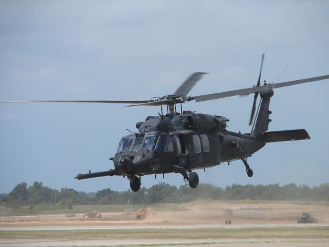 — — - Army Blackhawk departing south from taxiway Bravo.