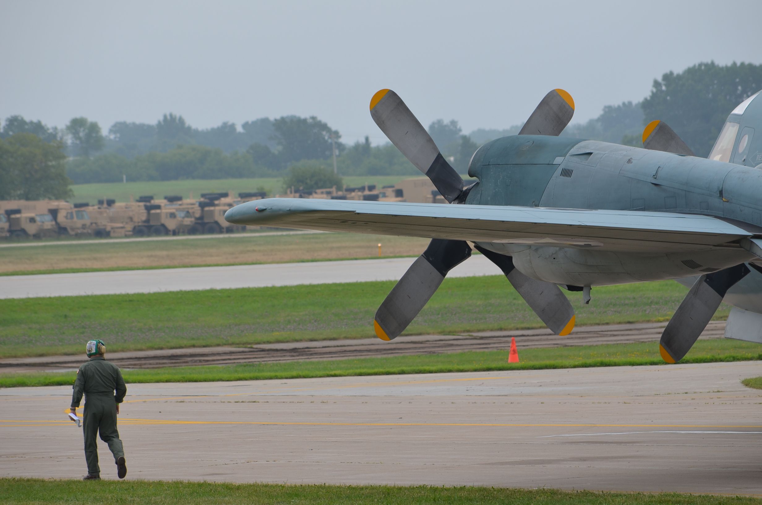 Lockheed P-3 Orion — - EAA 2011, pre-departure walk around on P3C. I wanted to show scale of how large props look with crew nearby.