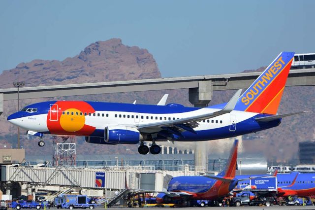 Boeing 737-700 (N230WN) - Southwest Boeing 737-7H4 N230WN Colorado One at Phoenix Sky Harbor on January 24, 2016. It first flew on February 2, 2012. Its construction number is 34592. It was delivered to Southwest on February 14, 2006. 