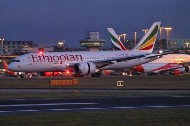 Boeing 787-8 (ET-ATJ) - Nice contrast with the Emirates fin behind.  ETH728 arrives from BRU in the early morning.