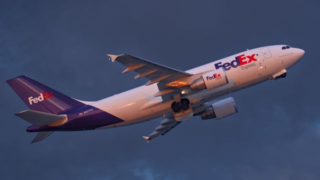 Airbus A310 (N807FD) - Sunrise takeoff under overcast skies. Taken at ISO 1600 - Nikon D750 - Nikkor 200-400 VR Zoon wide open