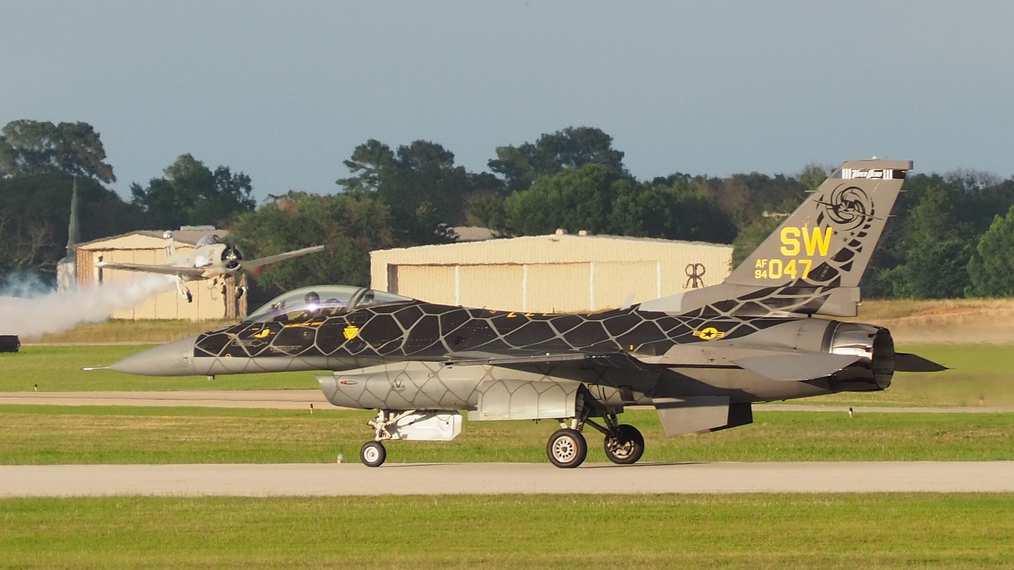Lockheed F-16 Fighting Falcon (94-0047) - F-16 returning from aerial demonstration and a T-28A departing on runway 22 Tyler Pounds Field, Tyler, Texas.  Historic Aviation Museum Airshow, July 2, 2021.