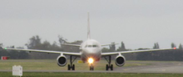Airbus A320 (VH-VFT) - This is a Jetstar A320 taxiing to the domestic terminals in Christchurch.