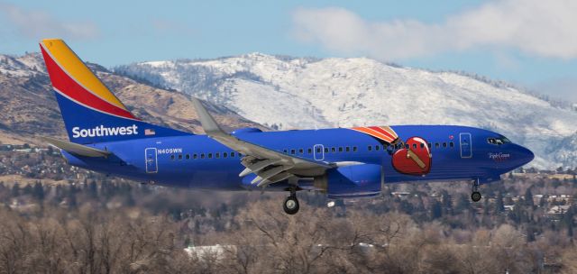 Boeing 737-700 (N409WN) - SWs "Triple Crown One" arriving from San Diego (KSAN) at forty-five minutes before noon.  This was the fourth special livery to arrive at RNO within three hours.  All four were different airlines (AAL, JBU, QXE, and SWA).