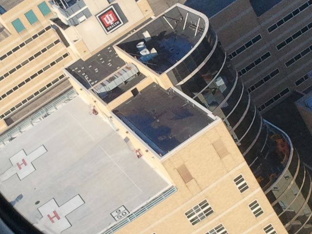 KAWASAKI EC-145 (N197LL) - descending to the Indiana University Health Methodist Helipad for fuel and re-stocking after completing a medical mission, then an empty leg to KHUF for positioning.  photo by EJ Claflin, FP-C