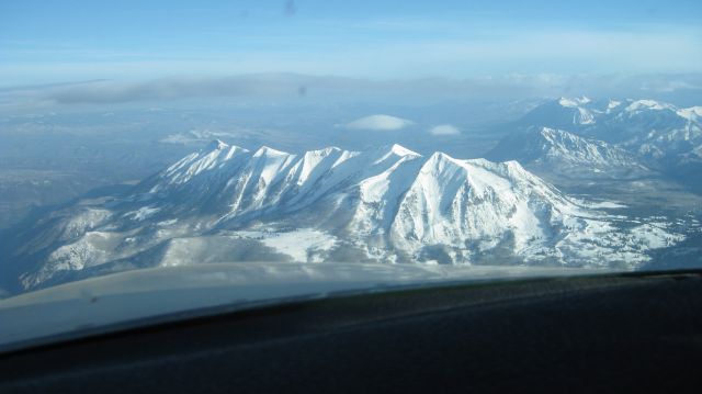 Piper PA-30 Twin Comanche — - Flying over the Rocky Mountains