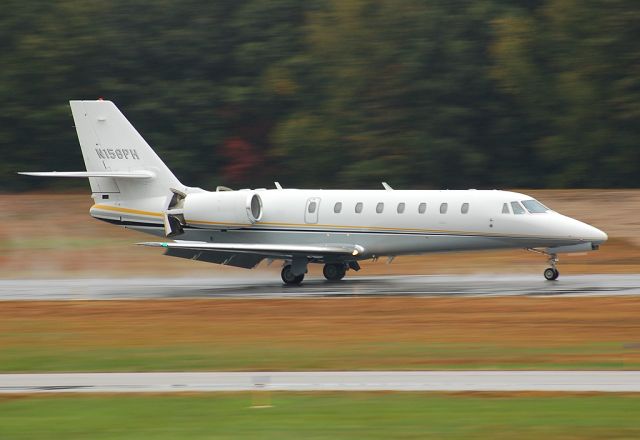 Cessna Citation Sovereign (N156PH) - Sharp 680 landing in the morning rain arriving from Cleveland, OH. I sure love the 680s!