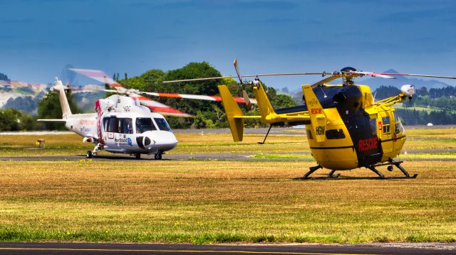 Sikorsky S-76 (ZK-HQC) - ZK-HQC conducting a training exercise whilst ZK-HGW sits dormant at Whangarei.