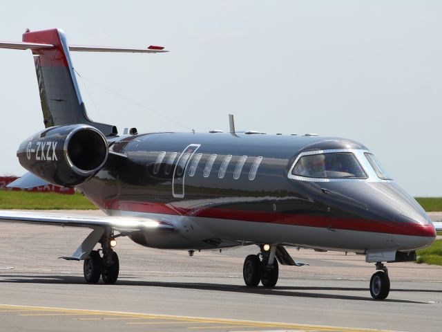 Learjet 45 (G-ZXZX) - The sleek Learjet 75 taxies into the terminal at Luton Airport.