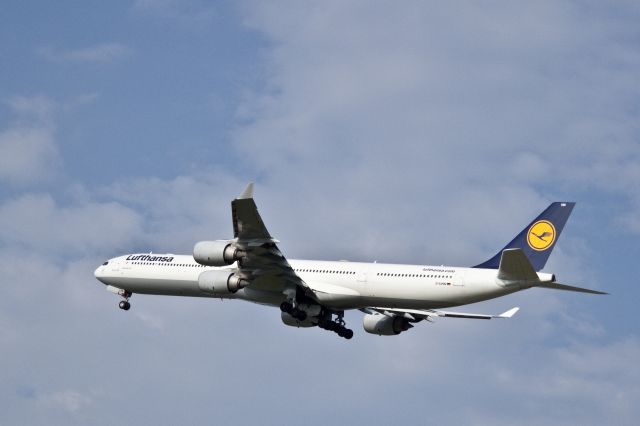 Airbus A340-600 (D-AIHN) - A warm evenings reverie and soft breeze are shattered by the  dramatic, powerful departure of this Airbus from runway 36C in Charlotte, North Carolina USA for Munich, Germany (EDDM). The nose and main landing gear doors have just sequenced open for gear retraction. Safely above the ground with good airspeed, the aircraft will be "cleaned up" (flaps, slats and landing gear retracted) as it climbs to cruising altitude.