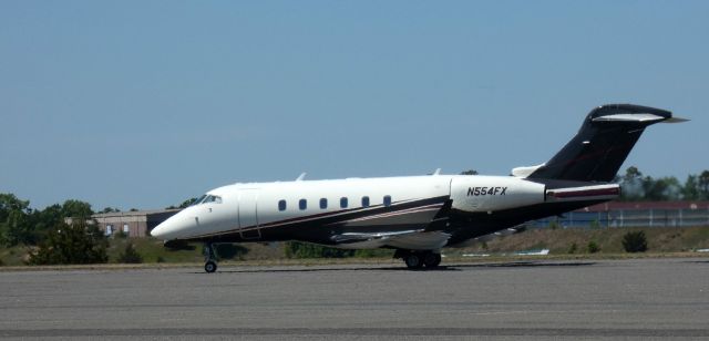 Bombardier Challenger 300 (N554FX) - Taxiing to parking is this 2005 Bombardier Challenger 300 in the Spring of 2023.