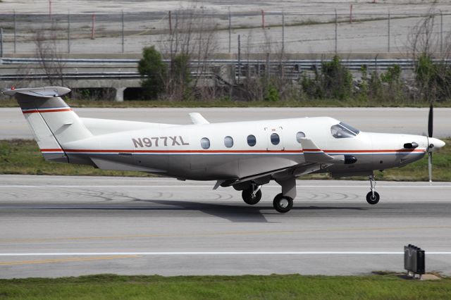 Pilatus PC-12 (N977XL) - Taking off for Boca Raton, Florida.