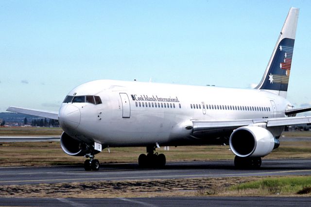 Robinson R-44 (VH-RMD) - ANSETT AIRLINES OF AUSTRALIA - BOEING 767-277 - REG : VH-RMD (CN 22692/24) - KINGSFORD SMITH SYDNEY NSW. AUSTRALIA - YSSY 28/6/1988 35MM SLIDE CONVERSION USING A LIGHTBOX AND A NIKON P80 DIGITAL CAMERA IN THE MACRO MODE.