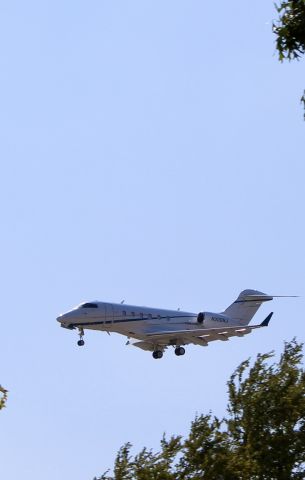 Bombardier Challenger 300 (N300NJ) - Silver Air CL30 landing at Dallas Love Field spotted from Bachman Lake Park. 