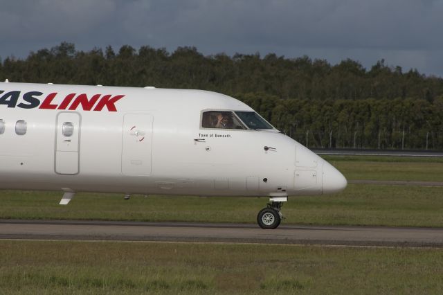 de Havilland Dash 8-400 (VH-LQG) - Frendly first officer giving the crowd a wave as they were waiting for Iron Maiden to land. Thankyou very much Captain