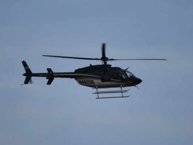 Bell 407 (N407DE) - DUKE ENERGY INDIANA INC flying just above the trees, following power lines through Huntersville and Cornelius, NC - 10/4/12