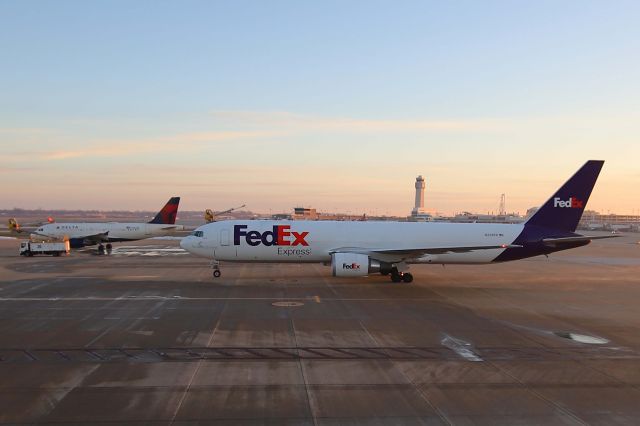 BOEING 767-300 (N296FE) - FDX437, a B767-3S2F (ER) and DAL1745, Delta A319-114, on pad-1 for deicing on 9 Jan 2021. FedEx was pulling in for deicing while N352NB had just finished.