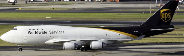 Boeing 747-400 (N579UP) - UPS 747-400F arrived from PHNL, the photo was taken from level 12 of the international carpark at YSSY