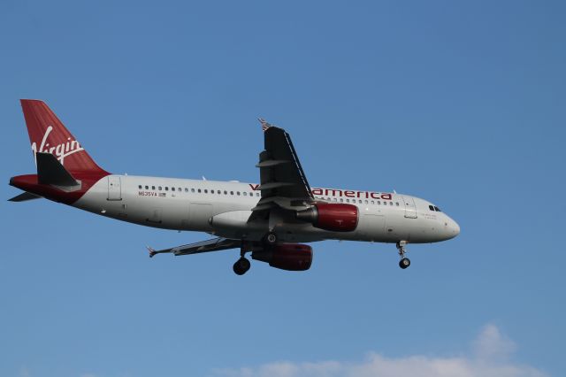 Airbus A319 (N635VA) - A Virgin America A319 about to land on 22L at Logan.br /br /Camera: Canon EOS Rebel T3 with a 100mm lens.