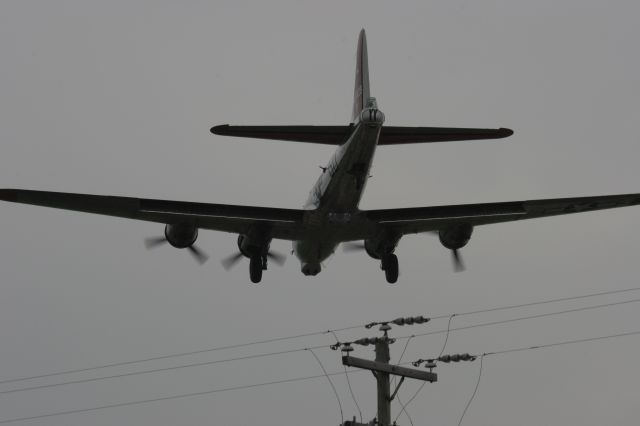 — — - B-17 Clears the Wires at Oshkosh - Runway 27 on a Cloudy Friday 2010 Airshow