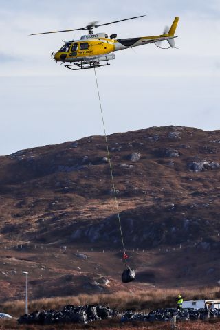 Eurocopter AS-350 AStar (G-LBRR) - Collecting bags of material associated with the installation of a phone mast near Lochboisdale in the Hebrides, Scotland.