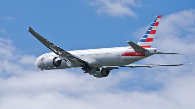 BOEING 777-300 (N729AN) - AAL9702 climbs from Rwy 16R beginning its delivery flight to KDFW on 5/19/14. (LN:1200 / cn 33127).